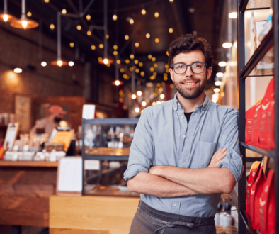 franchise business owner smiling at camera
